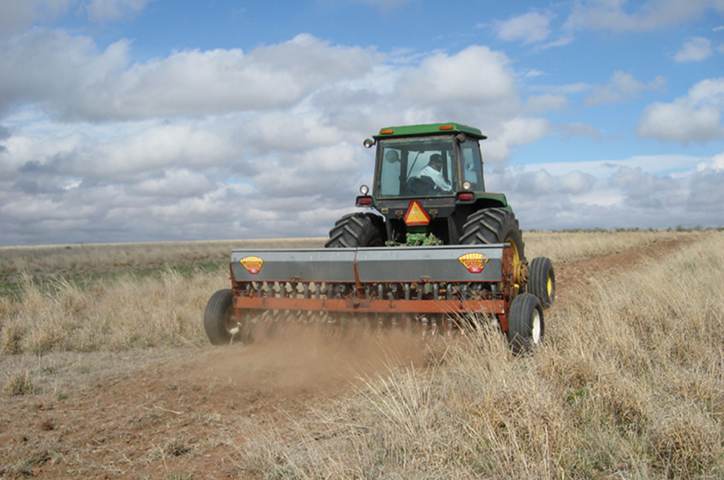 a tractor plowing a field