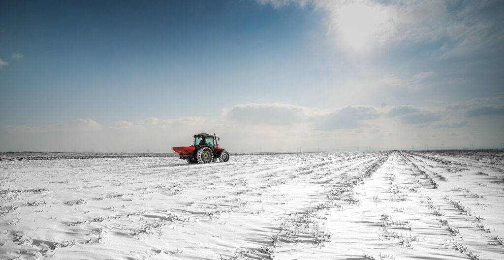 red tractor in a snowy field